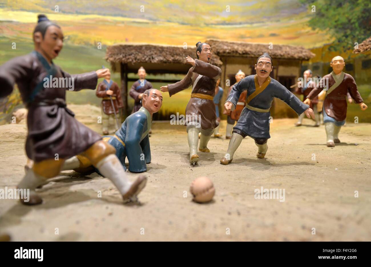 (151024) -- LINZI(SHANDONG), Oct. 24, 2015 (Xinhua) -- Photo taken on Oct. 23, 2015 shows the model reproducing the scene of ancient China's football game at Linzi Football Museum in east China's Shandong Province. China's Linzi Football Museum announced a partnership with the National Football Museum in Manchester, England on Friday. The two museums would work together to promote their shared objectives of communicating football culture to a world-wide audience. Linzi district, the birth place of Cuju, has been officially recognized by FIFA in 2004 as the origin of football. (Xinhua/Zhu Zhe Stock Photo