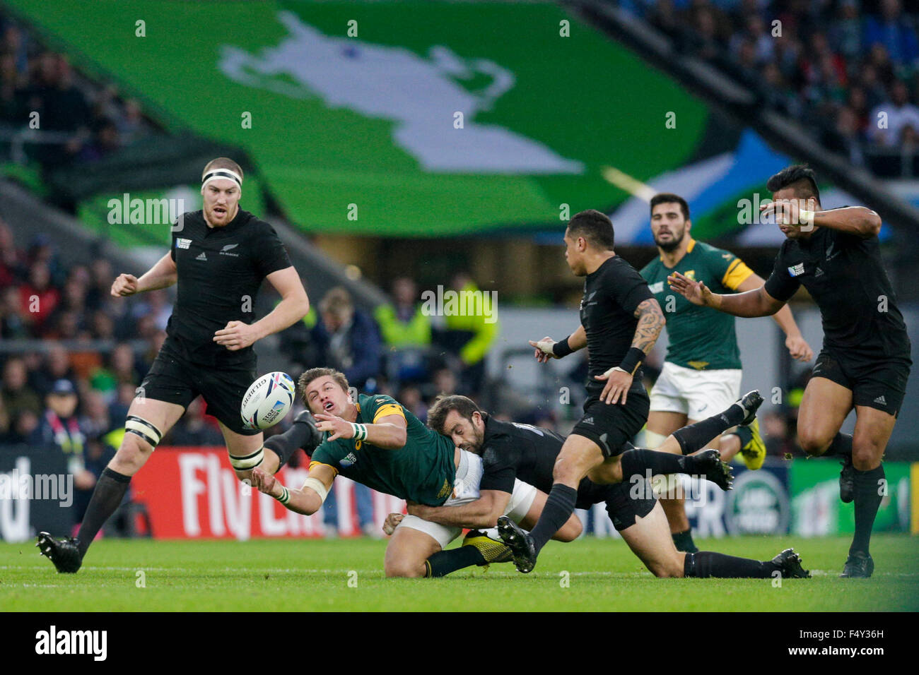 Twickenham Stadium, London, UK. 24th Oct, 2015. Rugby World Cup Semi Final. South Africa versus New Zealand. South Africa outhalf Handre Pollard spills the ball forward after re-gathering his own kick before being tackled by New Zealand centre Conrad Smith Credit:  Action Plus Sports/Alamy Live News Stock Photo