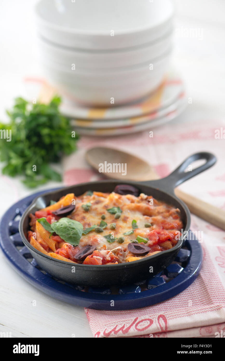 Penne Pasta, with sauce olives and basil, One pan meal Stock Photo