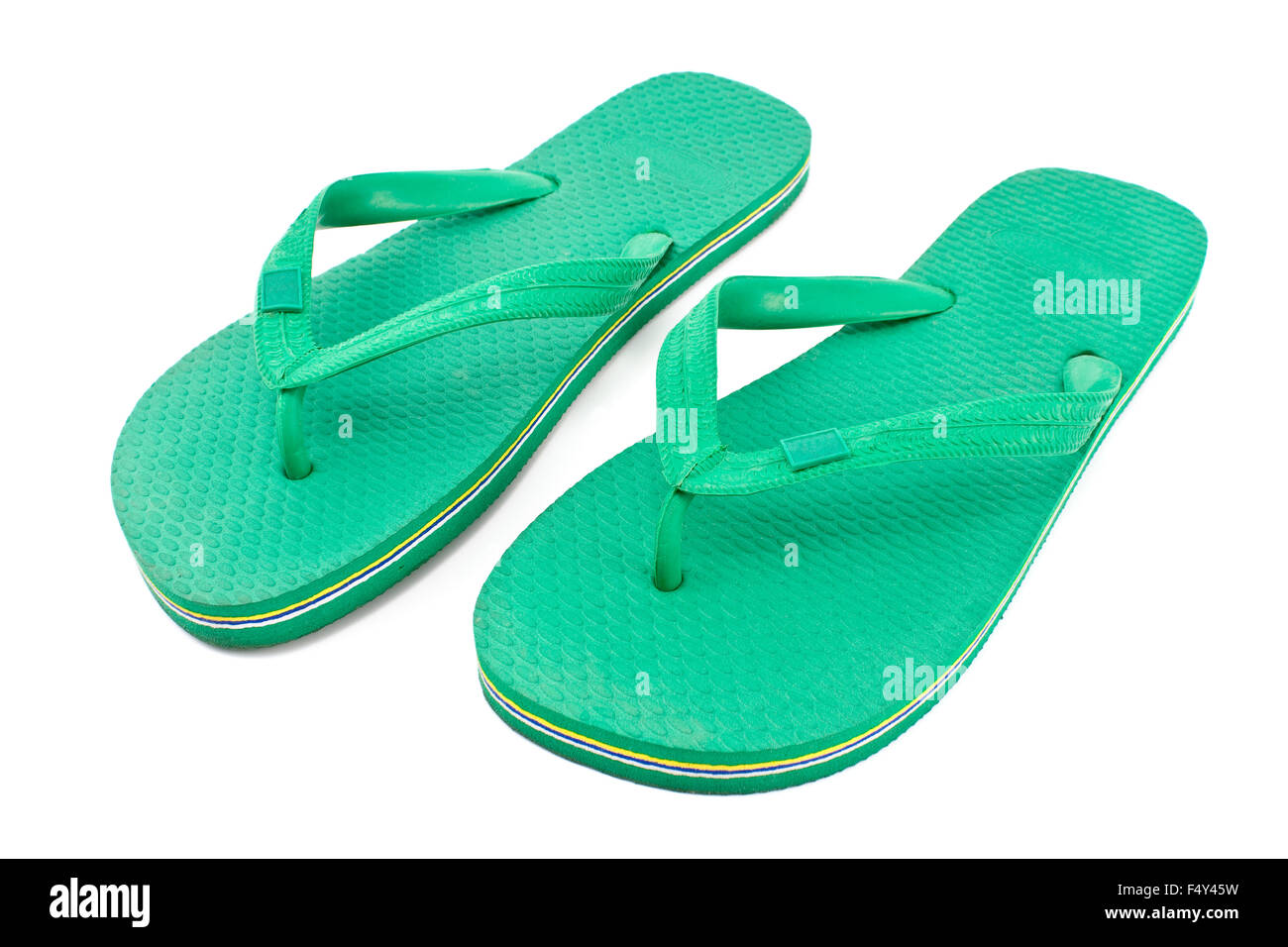 Pair of green rubber flip flop sandals isolated on white Stock Photo