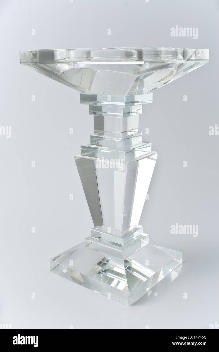 Glass candlestick on gray background Stock Photo