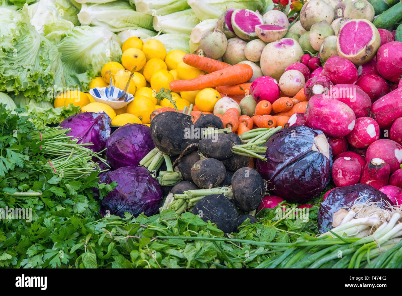 Vegetables, herbs and salad for sale at a market Stock Photo