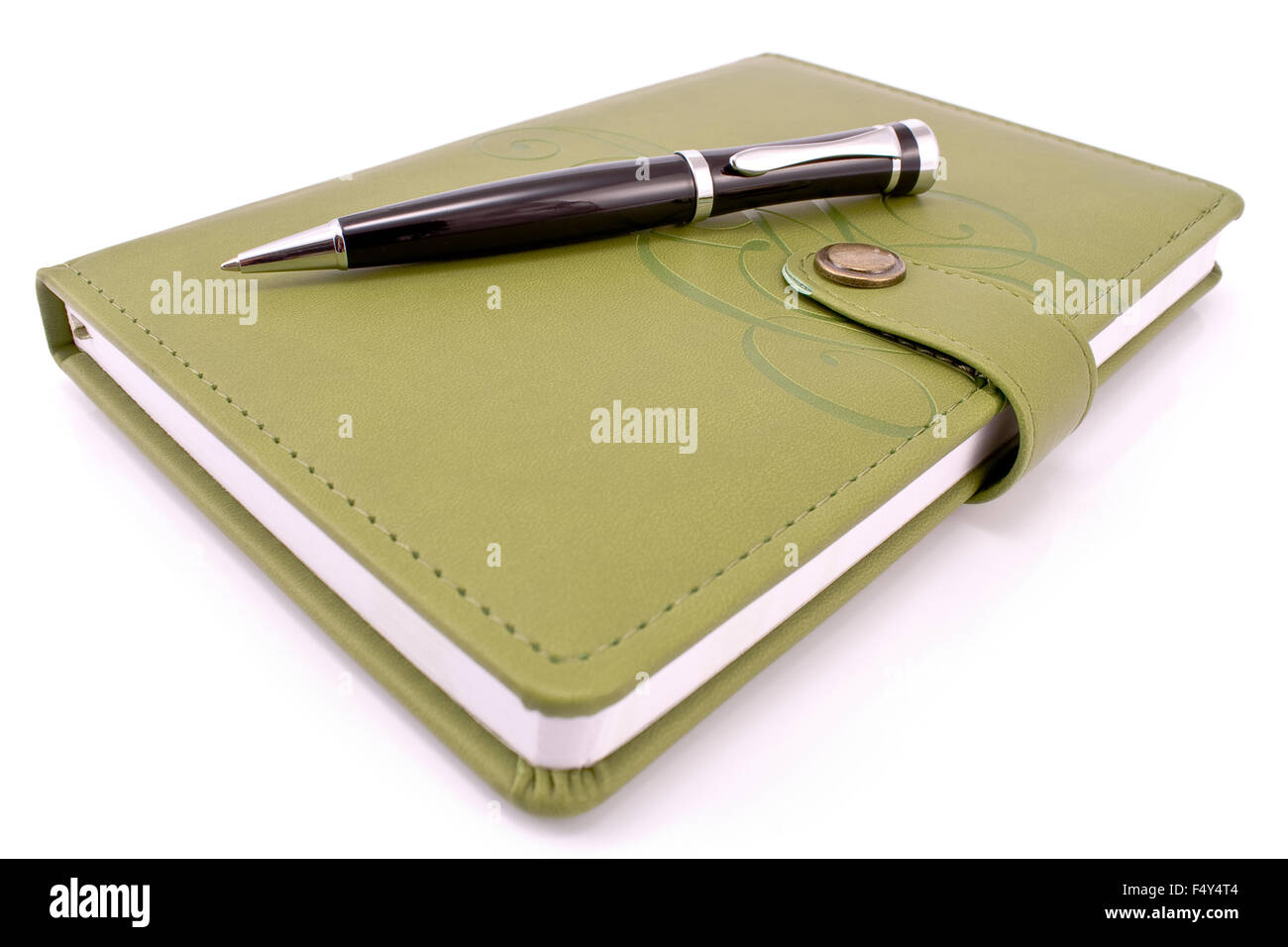 Pen and green notebook isolated on white Stock Photo