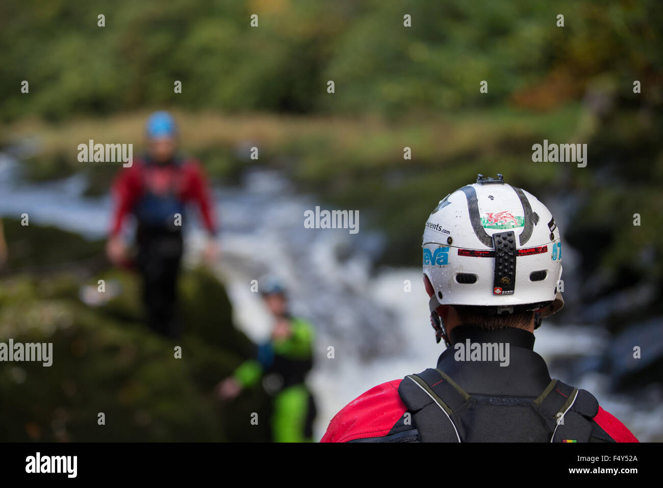 Henllan, Ceredigion, Wales, UK. 24th Oct, 2015. The annual Teifi Tour takes place this weekend. Kayakers, mainly from College and University kayaking clubs take to the River Teifi, from Llandysul to Poppit Sands, to enjoy a weekend of high adrenaline adventure. Pictured are kayakers negotiating the falls at Henllan Bridge. Credit:  atgof.co/Alamy Live News Stock Photo