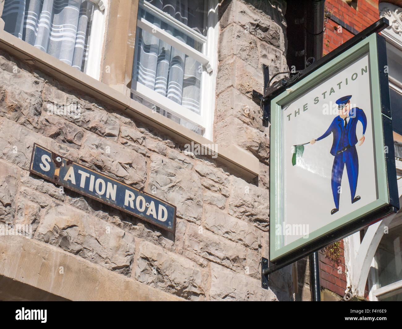 The Station pub sign in on Station Road in Colwyn Bay Wales UK Stock Photo