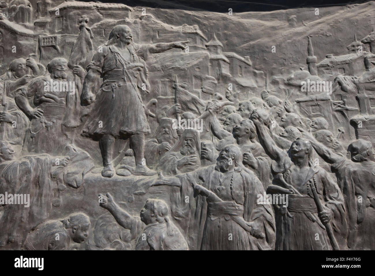 Closeup detail fom the Battle of Dervenakia and the old man of Morea giving a speech depiction, on the base of his monument. Stock Photo