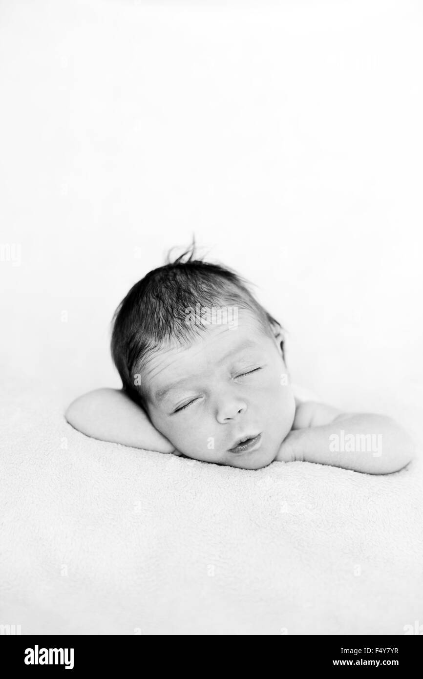 adorable newborn baby on a bed Stock Photo Alamy
