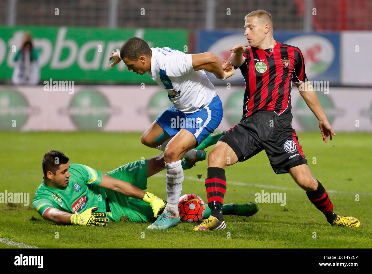 BUDAPEST, HUNGARY - OCTOBER 24, 2015: Lajos Hegedus of MTK (l) tries to get the ball next to Myke Bouard Ramos and Djordje Kamber (r) of Honved during MTK vs. Honved OTP Bank League football match in Illovszky Stadium. Credit:  Laszlo Szirtesi/Alamy Live News Stock Photo