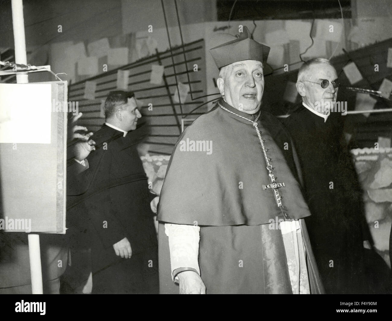 A cardinal visit an exhibition, Italy Stock Photo