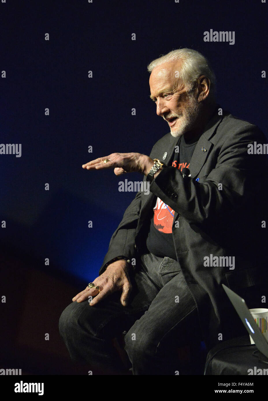 Garden City, New York, USA. 23rd Oct, 2015. Former NASA astronaut Edwin BUZZ ALDRIN gestures with his left hand out flat during conversation about his early years, experiences in space, and his new Children's Middle Grade book Welcome to Mars: Making a Home on the Red Planet. After the talk at the jetBlue Sky Theater Planetarium at Long Island's Cradle of Aviation Museum, Aldrin signed copies of his new book. On the 1969 Apollo 11 mission, Buzz Aldrin was the second person ever to walk on the Moon, and his first trip to space was the 1966 Gemini 12. (Credit Image: © Ann Parry via Z Stock Photo