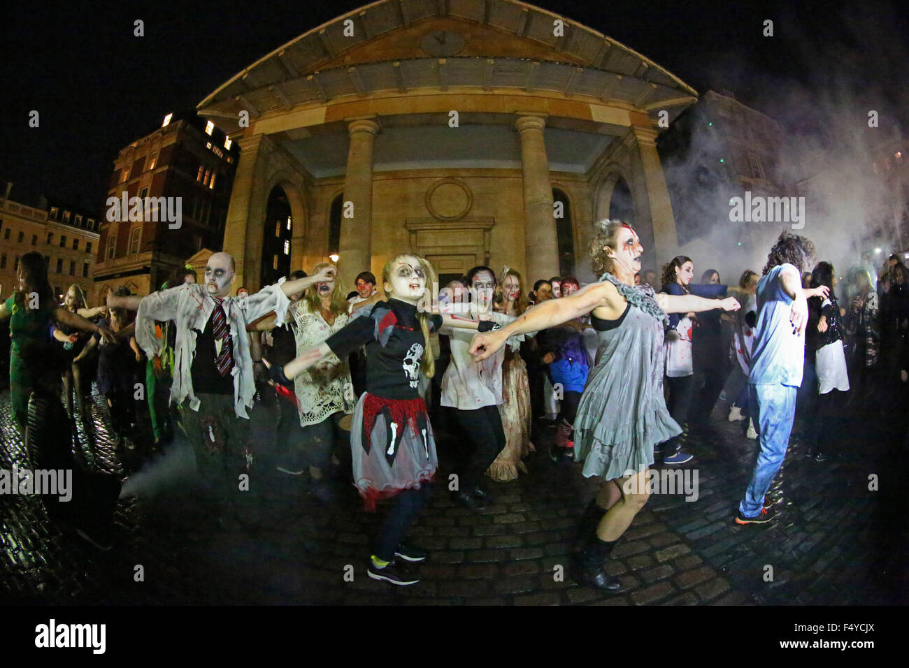 London, UK. 24th October 2015. Participants dressed as Zombies at the Thrill the World Zombie Flash Mob, Covent Garden, London which is an annual worldwide event to try and break the record for the most number of people dancing simultaneously to Michael Jackson's Thriller. It also raises money for humanitarian and charitable causes. Credit:  Paul Brown/Alamy Live News Stock Photo