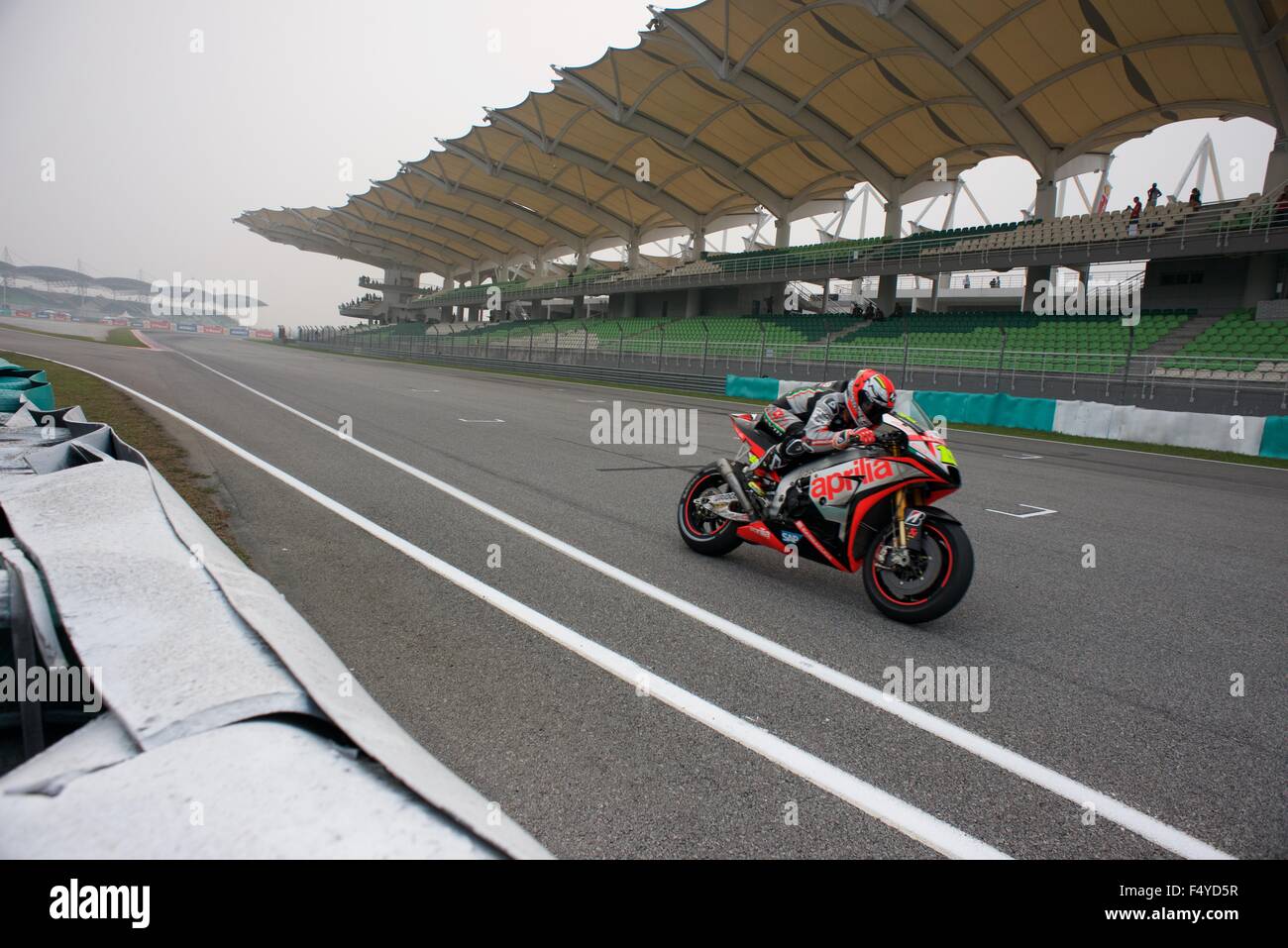 Sepang Circuit, Malaysia. 24th  Oct, 2015. Alvaro Bautista rides flat out past the main grandstand during qualifying for the Shell Malaysia Motorcycle Grand Prix at Sepang Circuit. Stock Photo