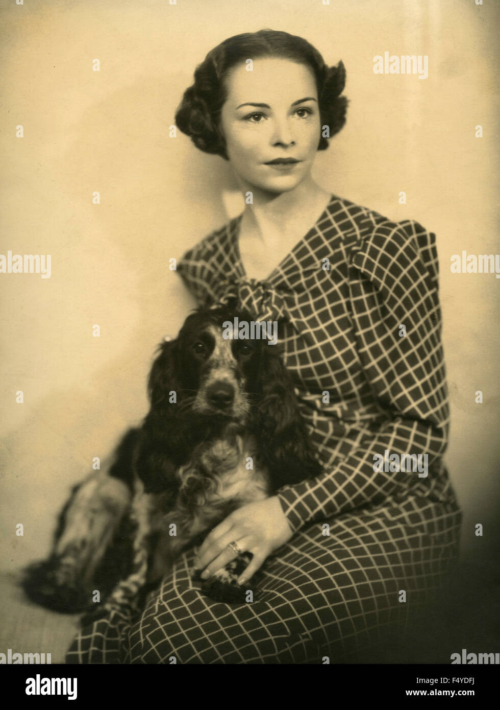 A woman with a dog cocker, Italy Stock Photo