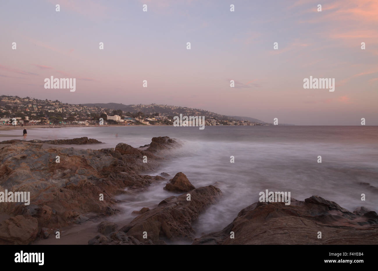 Long exposure of rocks in waves, giving a mist like effect over ocean in Laguna Beach, California Stock Photo