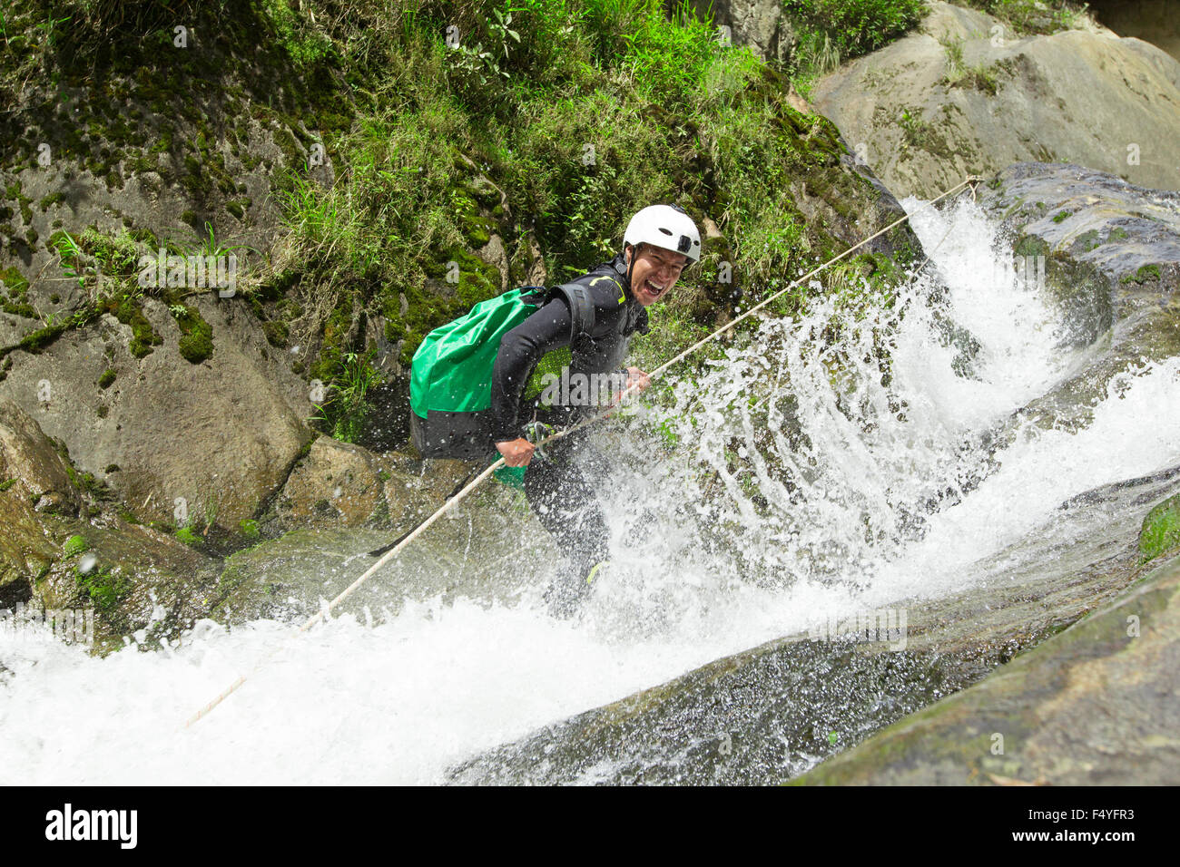 Canyoning Guid Trying Out A News Route In Chama Waterfall Banos De Agua Santa Ecuador Stock Photo