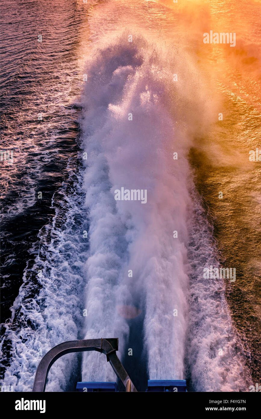 Ferry engine spray sunset time powerful engines Stock Photo