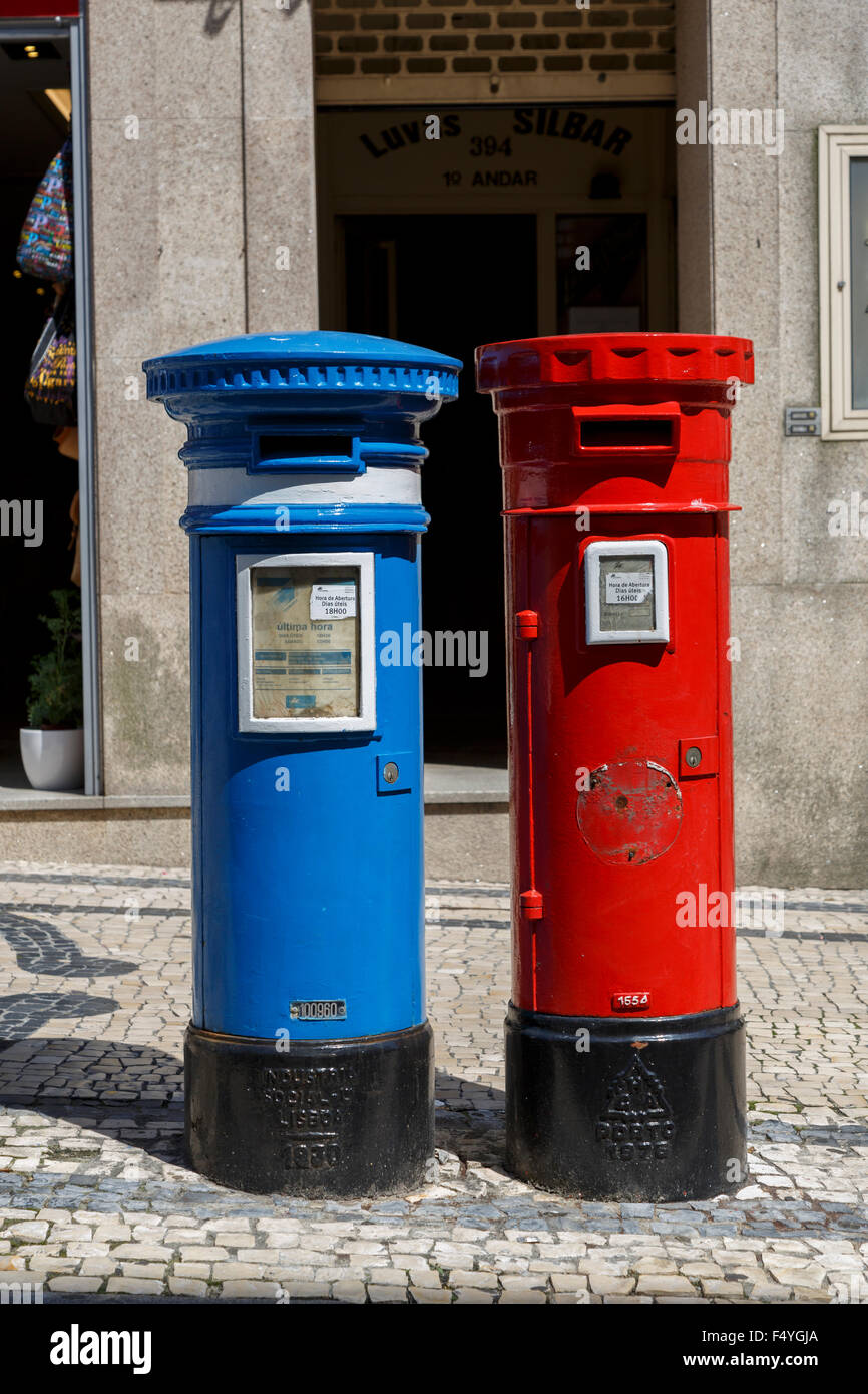Two variations of the high-aperture pillar box {post box) red (ordinary  mail) blue (airmail) Porto Portugal Stock Photo - Alamy