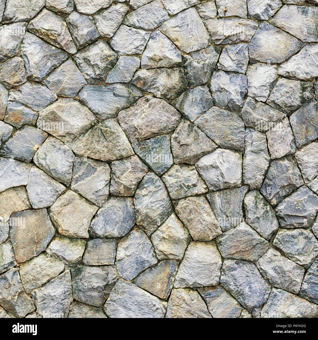 Stone wall. Texture of different forms stones similar to wall Stock