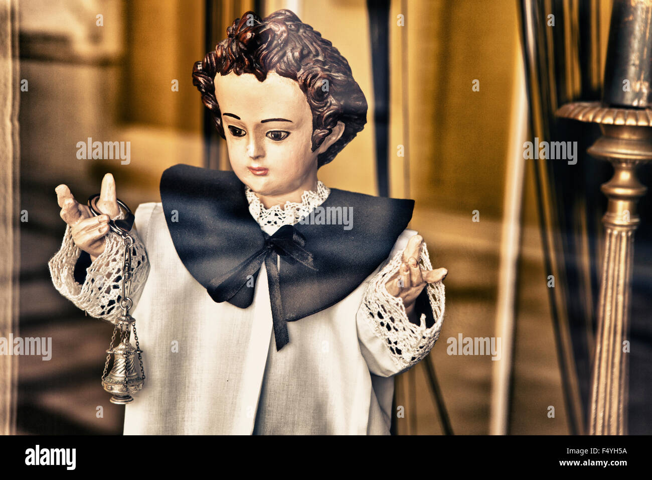 Doll of altar boy with censer in a shop window during the Holy Week in Spain Stock Photo