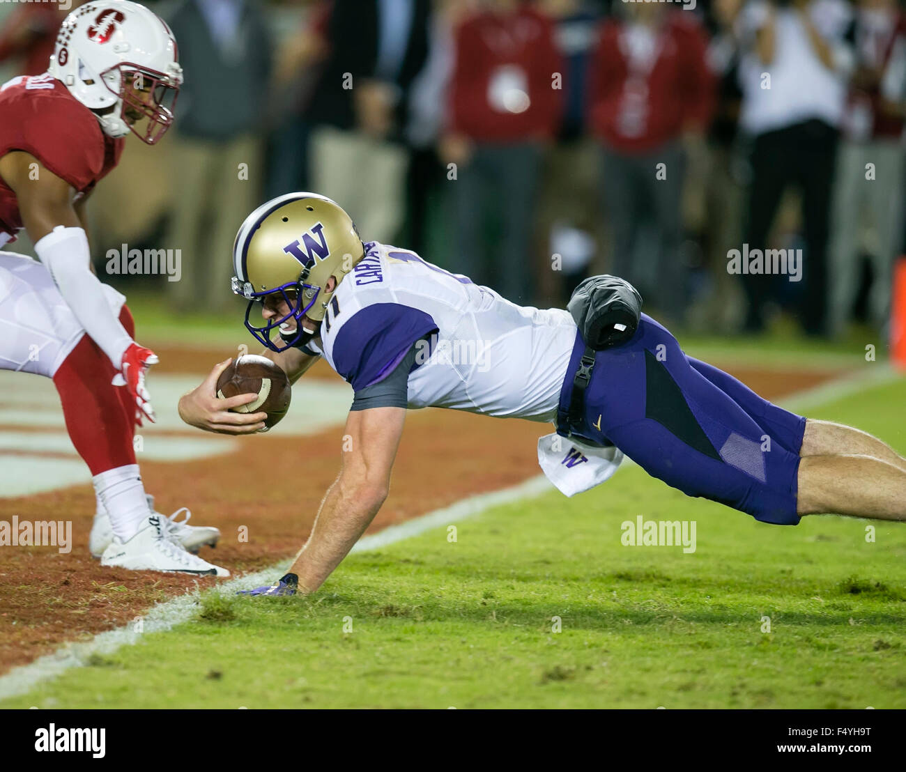 Palo Alto, CA. 24th Oct, 2015. Washington Huskies quarterback K.J. Carta-Samuels (11) dives into the end zone for a touchdown during the NCAA Football game between the Stanford Cardinal and the Washington Huskies at Stanford Stadium in Palo Alto, CA. Stanford defeated Washington 31-14. Damon Tarver/Cal Sport Media/Alamy Live News Stock Photo