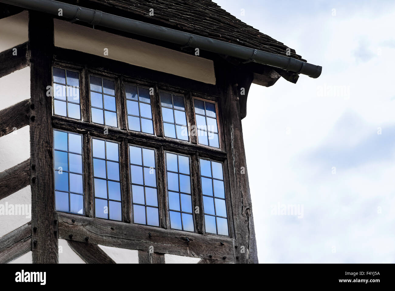 Tudor house exterior detail built in 1590 detail of window and roof Blakesley hall closeup Stock Photo