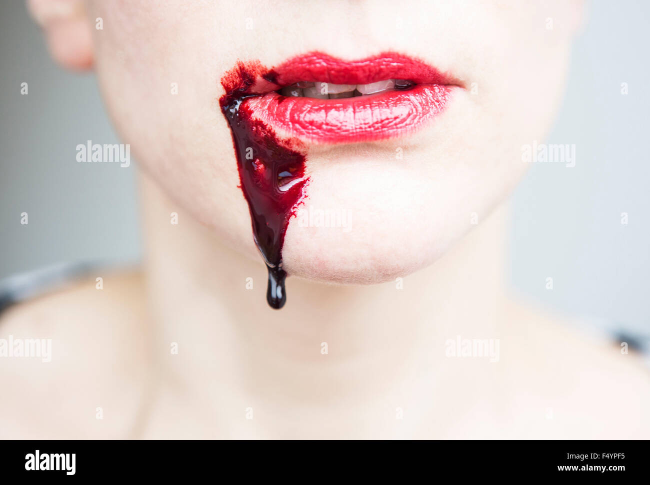 closeup of bloody mouth of woman Stock Photo