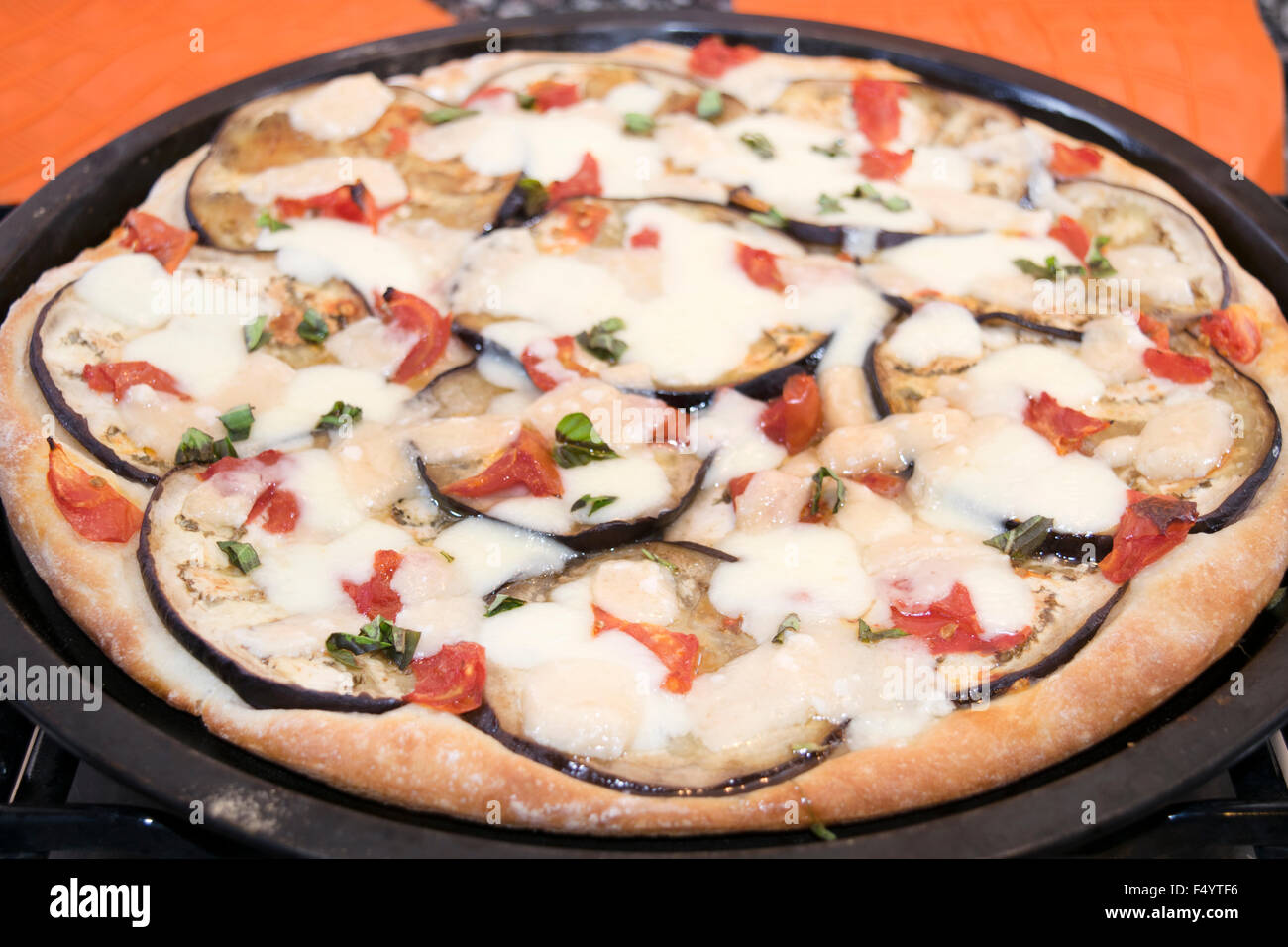 parmigiana pizza with aubergines mozzarella and parmesan Stock Photo