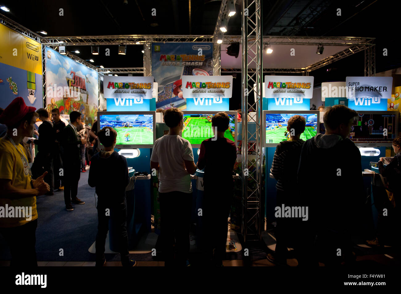 Warsaw, Poland. 24th Oct, 2015. Trade fair show games expo stands, children playing Mario Tennis games at Warsaw Games Week, Targi Gier Wideo, Hala Expo XXI, Warsaw, Poland, October 24, 2015, horizontal orientation, rights managed, editorial use only. Credit:  Arletta Cwalina/Alamy Live News Stock Photo