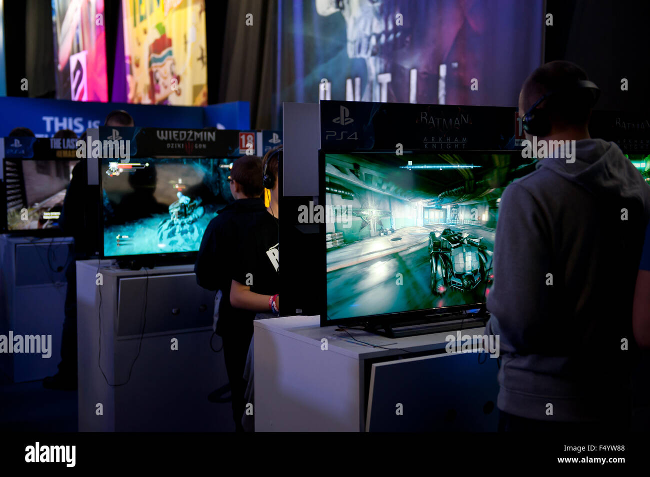 Warsaw, Poland. 24th Oct, 2015. Trade fair show consoles stand at games expo, people playing in Batman and Wiedzmin at Warsaw Games Week, Targi Gier Wideo, Hala Expo XXI, Warsaw, Poland, October 24, 2015, horizontal orientation, rights managed, editorial use only. Credit:  Arletta Cwalina/Alamy Live News Stock Photo