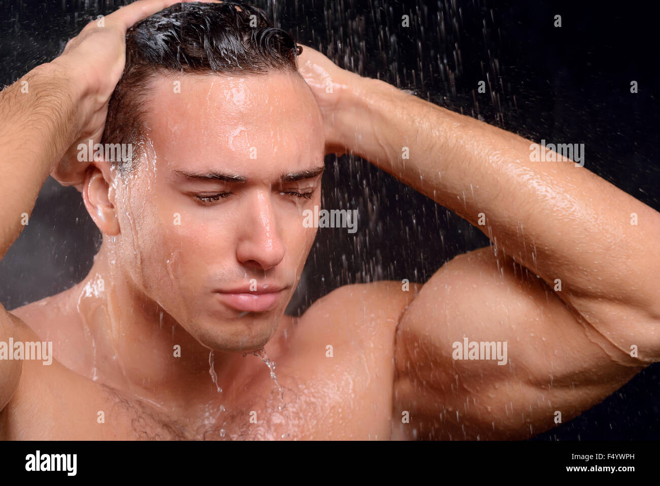 Handsome guy taking shower Stock Photo Alamy