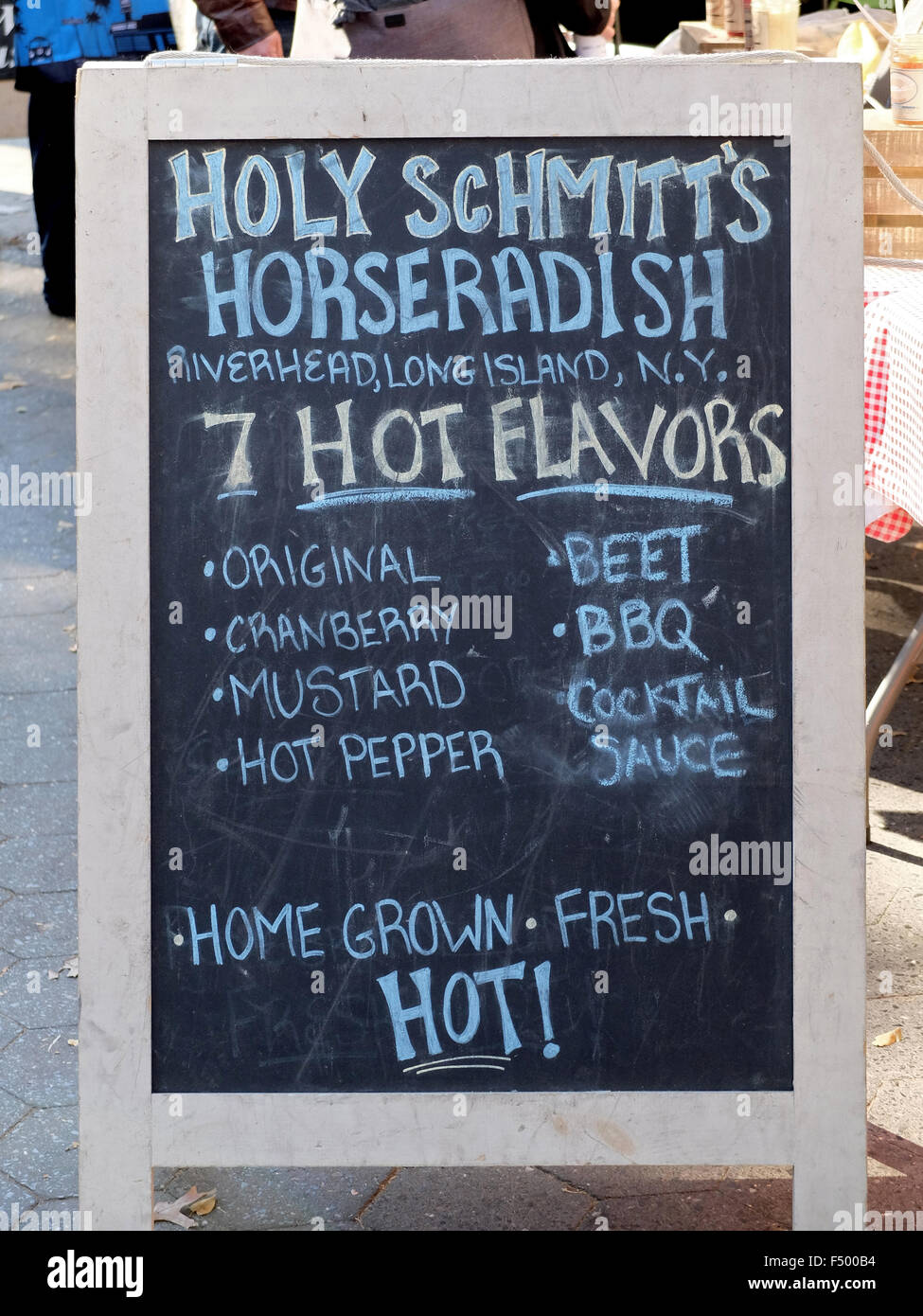 A sign advertising an unusual business at the Union Square green market in Manhattan, New York City Stock Photo