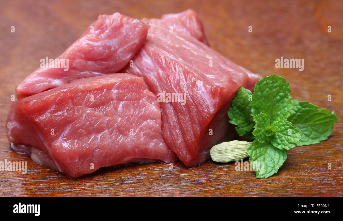 Raw beef on wooden surface Stock Photo