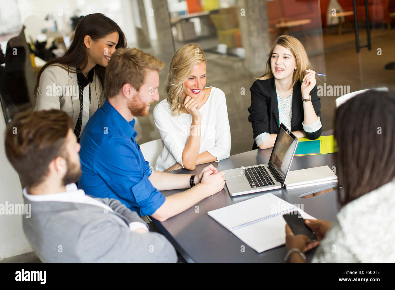 Young people in the office Stock Photo - Alamy