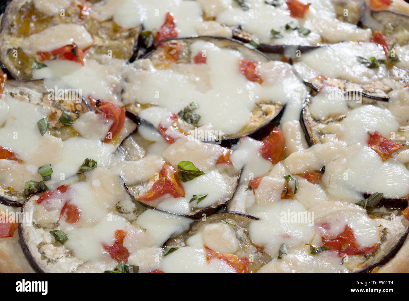 parmigiana pizza with eggplants parmesan cheese and mozzarella Stock Photo