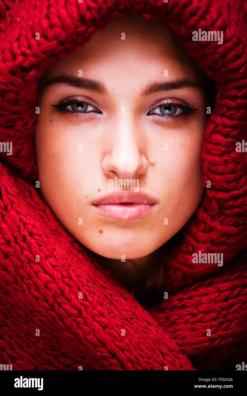 young pretty woman in sweater and scarf all over her face Stock Photo ...