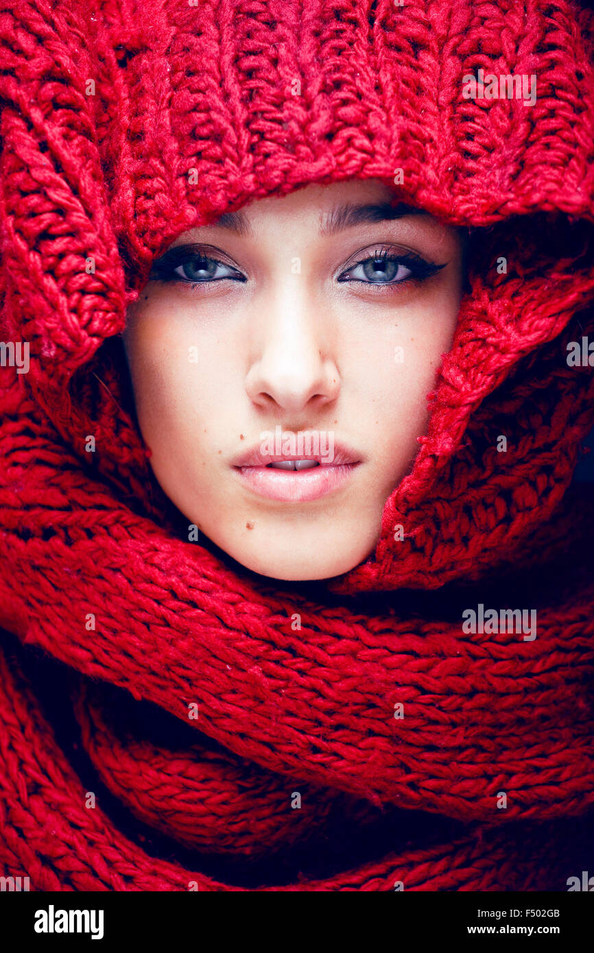 young pretty woman in sweater and scarf all over her face Stock Photo ...