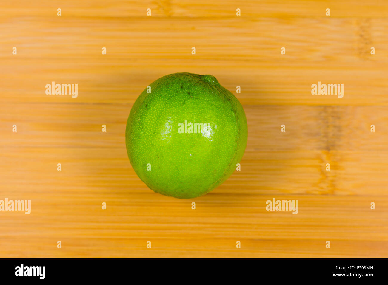 Close up tropic fruits lime on the wood table Stock Photo