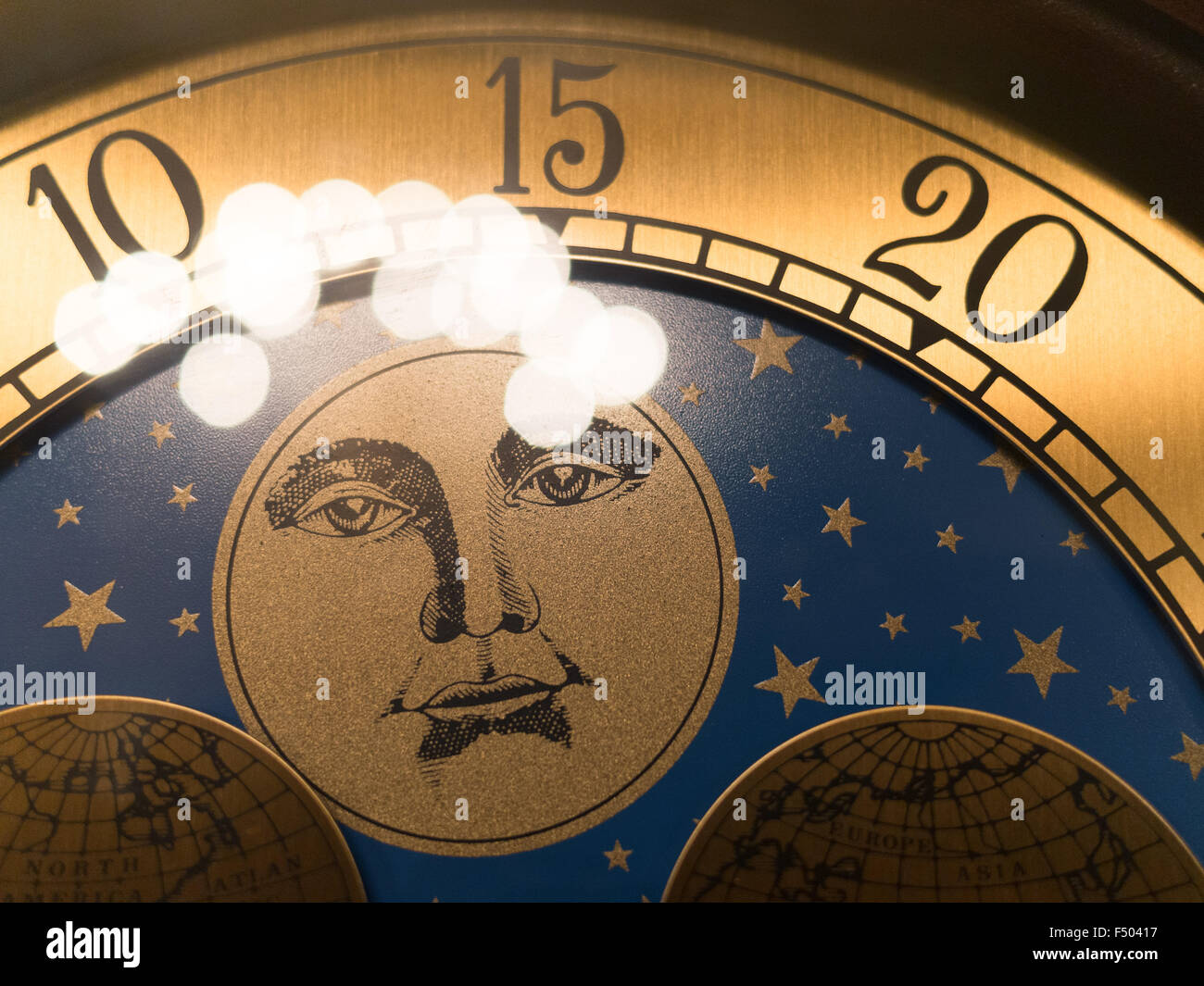 Man on the moon on an old grandfather clock Stock Photo