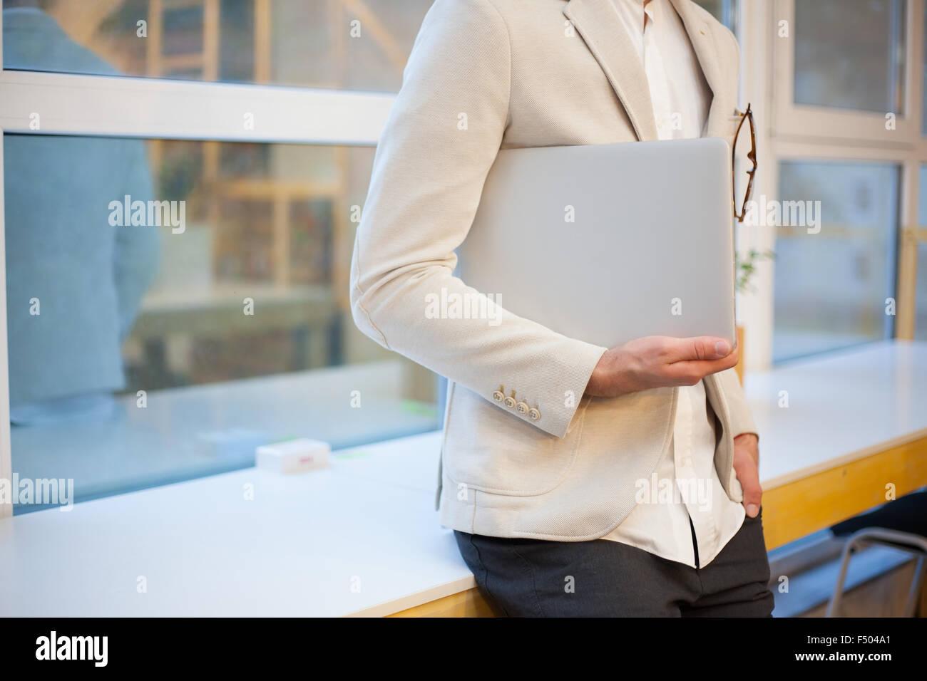 closeup of stylish employee with laptop Stock Photo