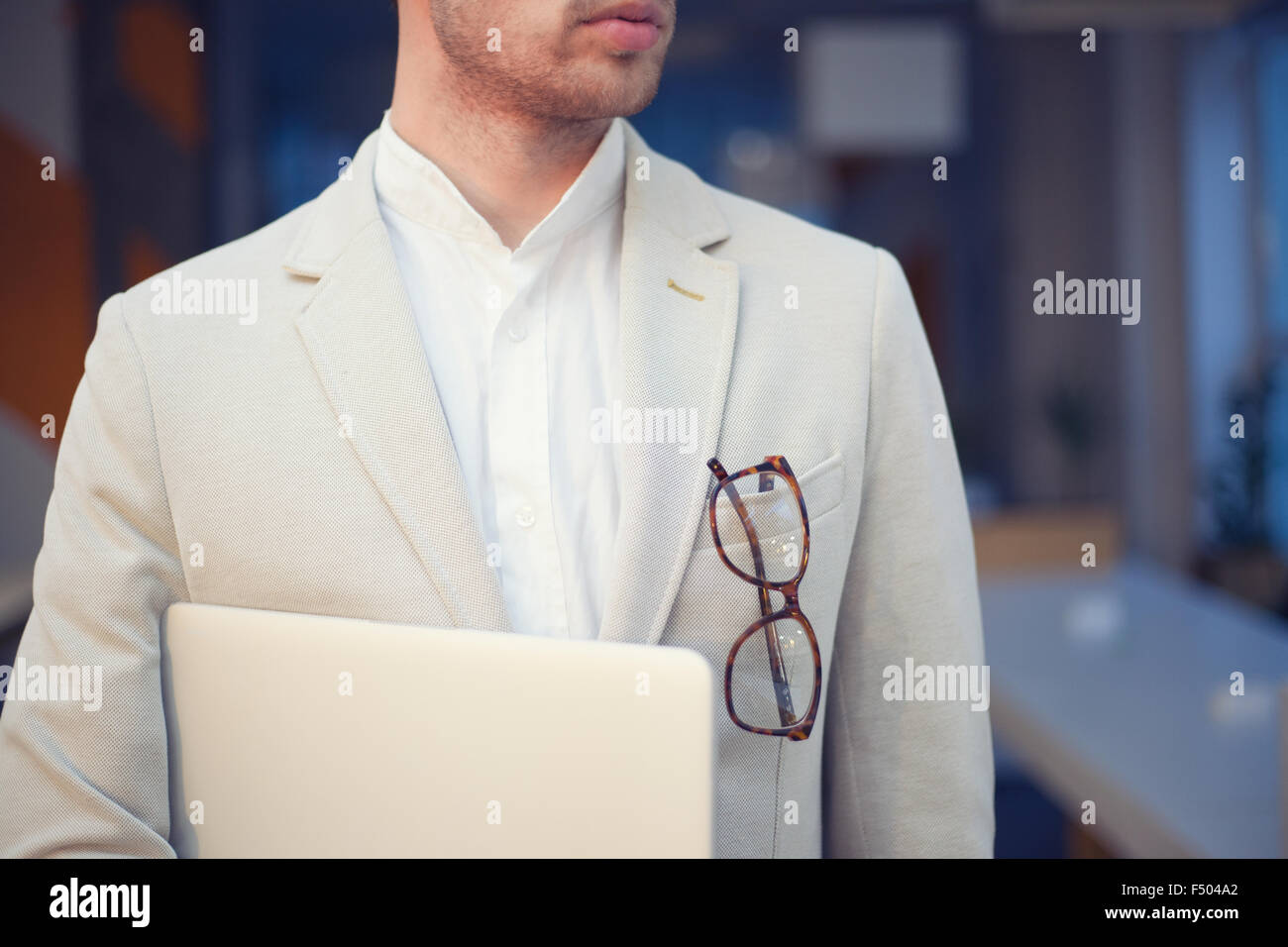 closeup of stylish employee with laptop Stock Photo