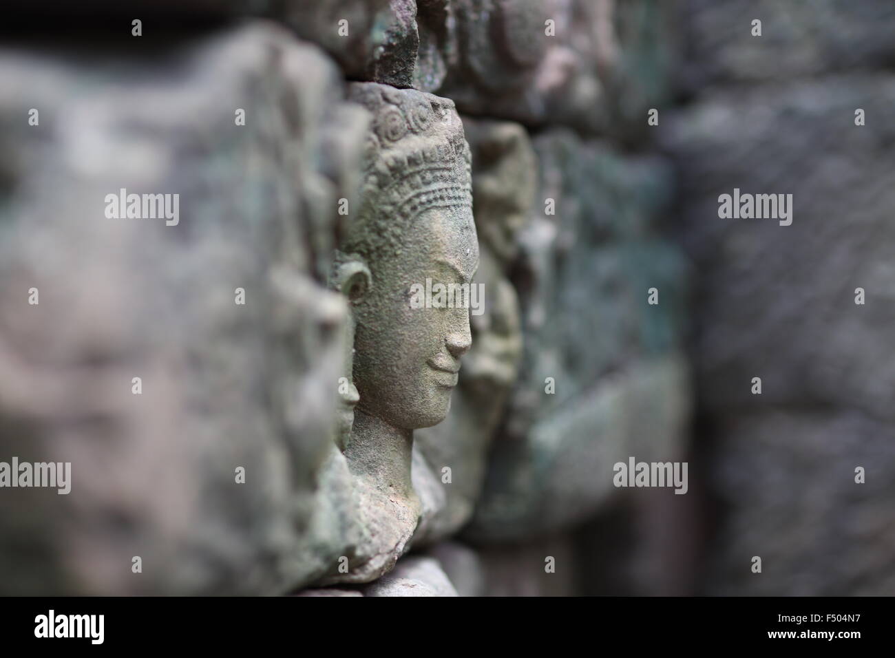 Selective focus on stone carving of a female. Stock Photo