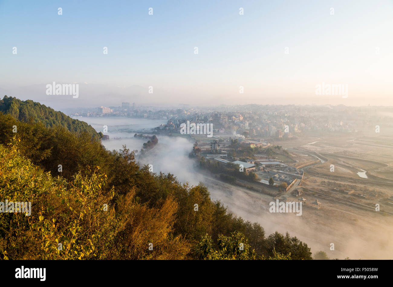 Kathmandu Valley in smog, snowy mountains in distance Stock Photo