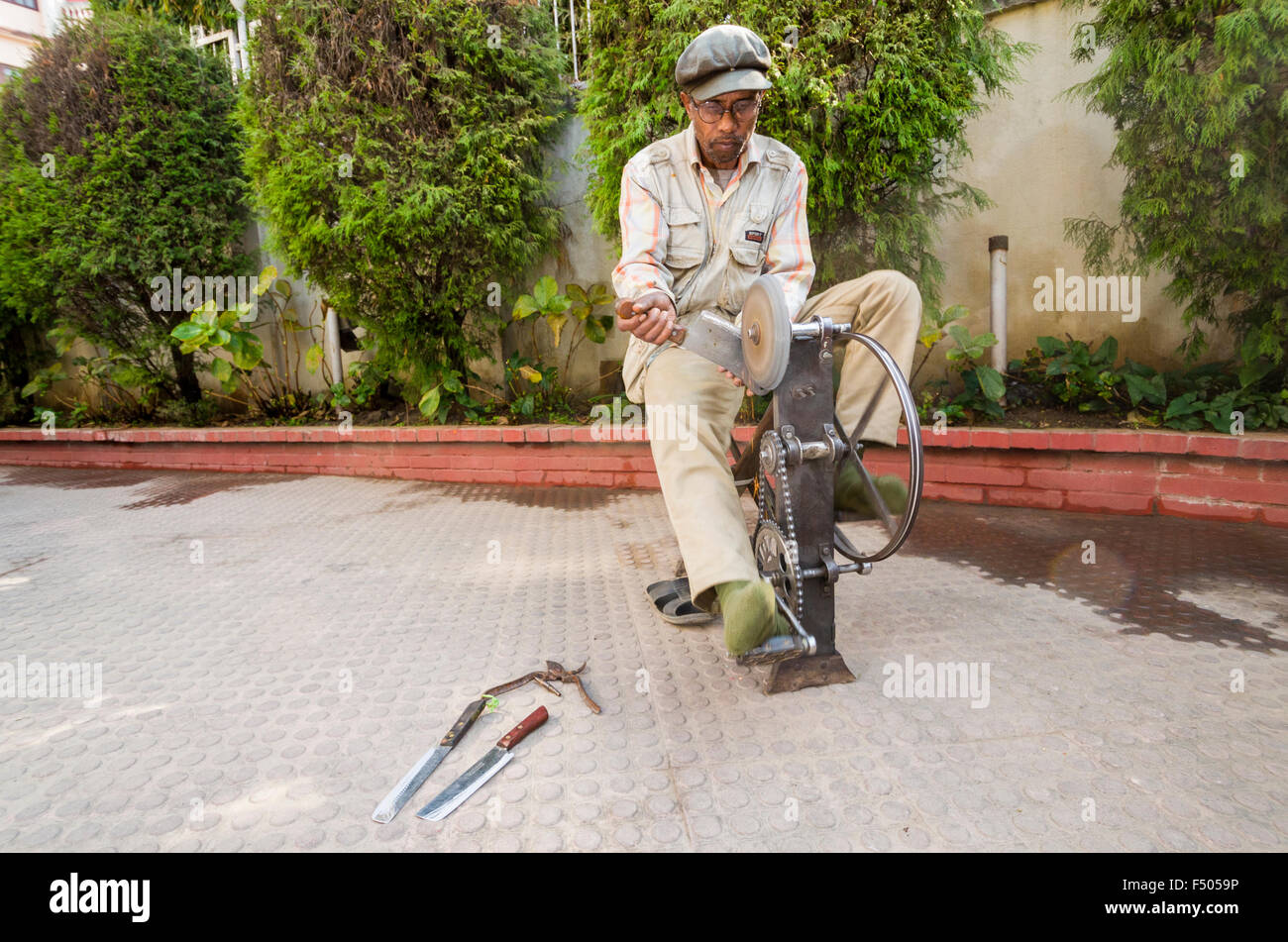 Knife grinder at work Stock Photo