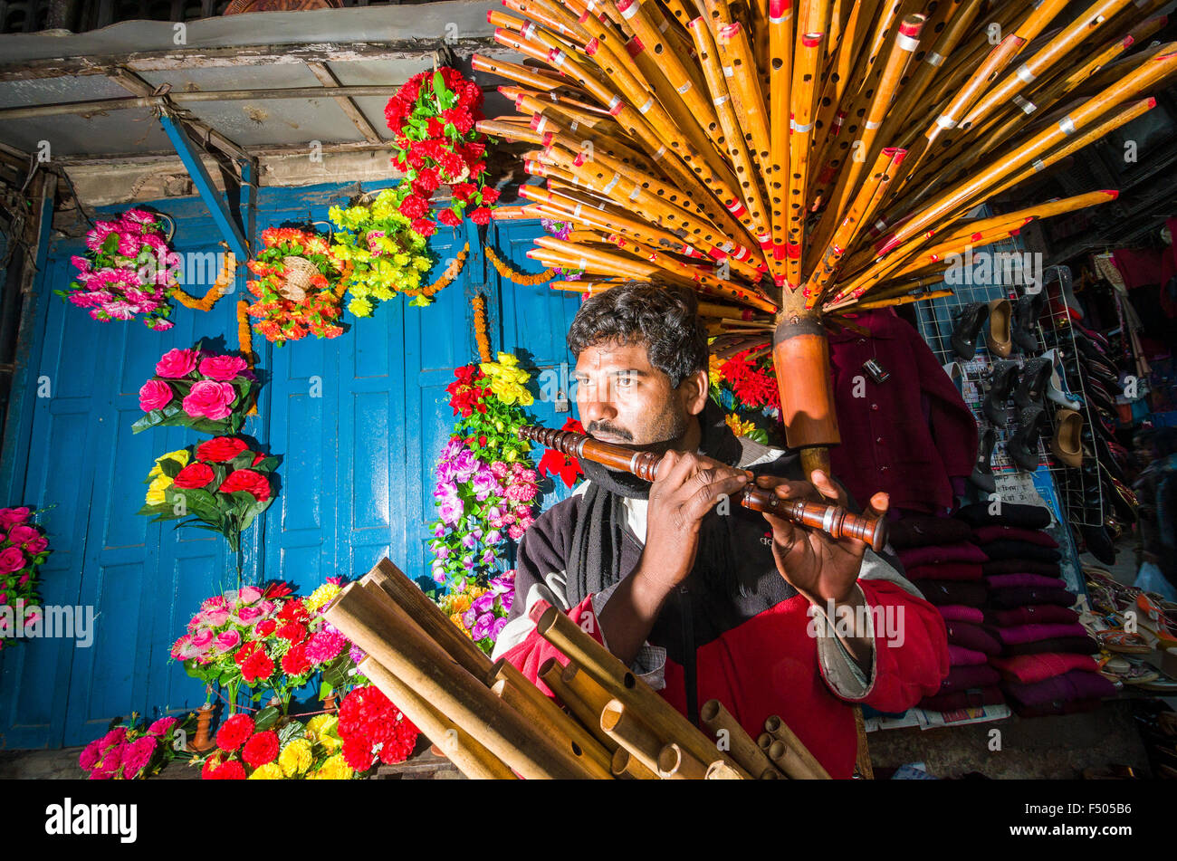 Flute vendor playing flute in the streets Stock Photo Alamy
