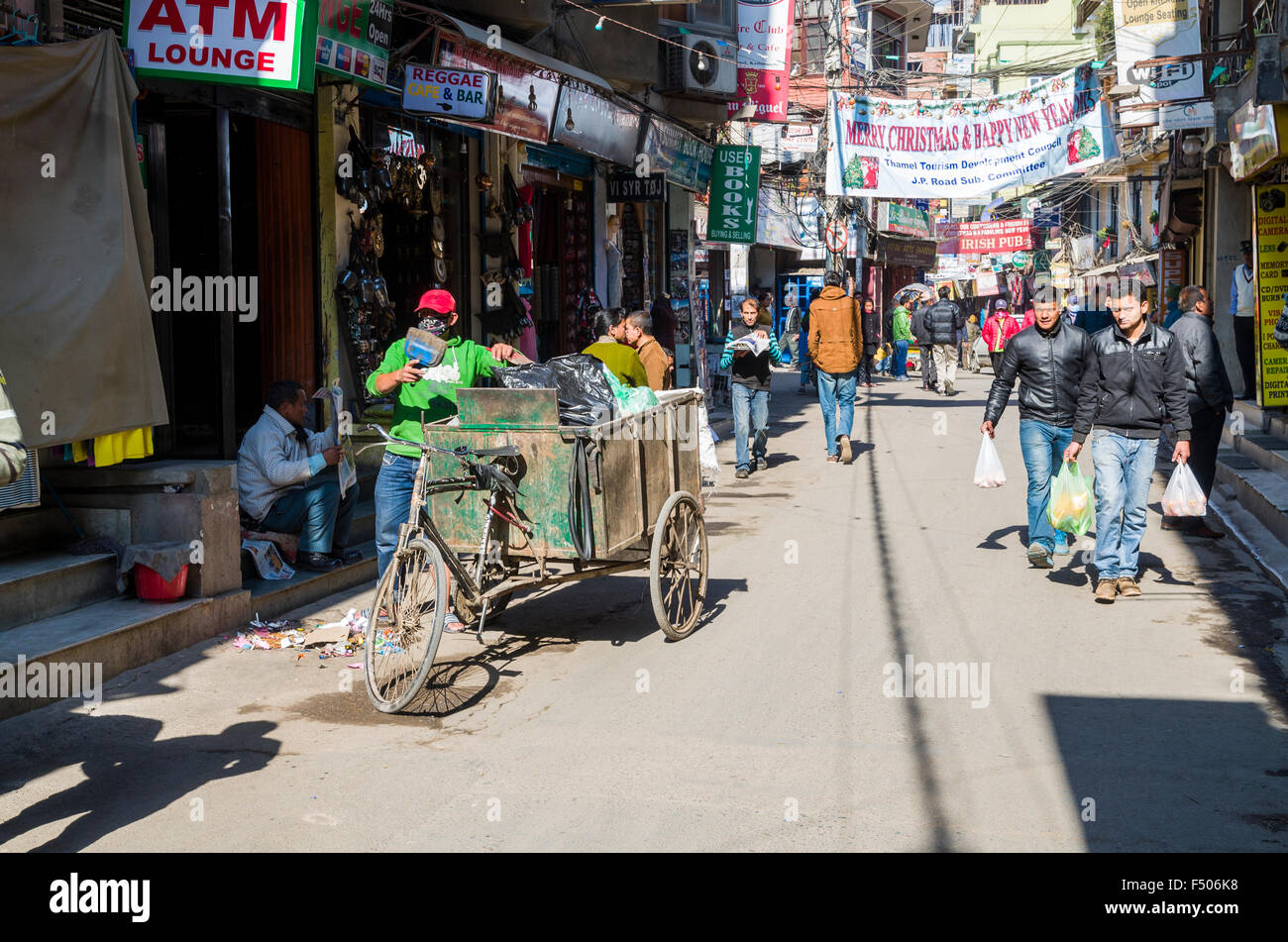 Garbage on the street gets collected by low caste workers Stock Photo