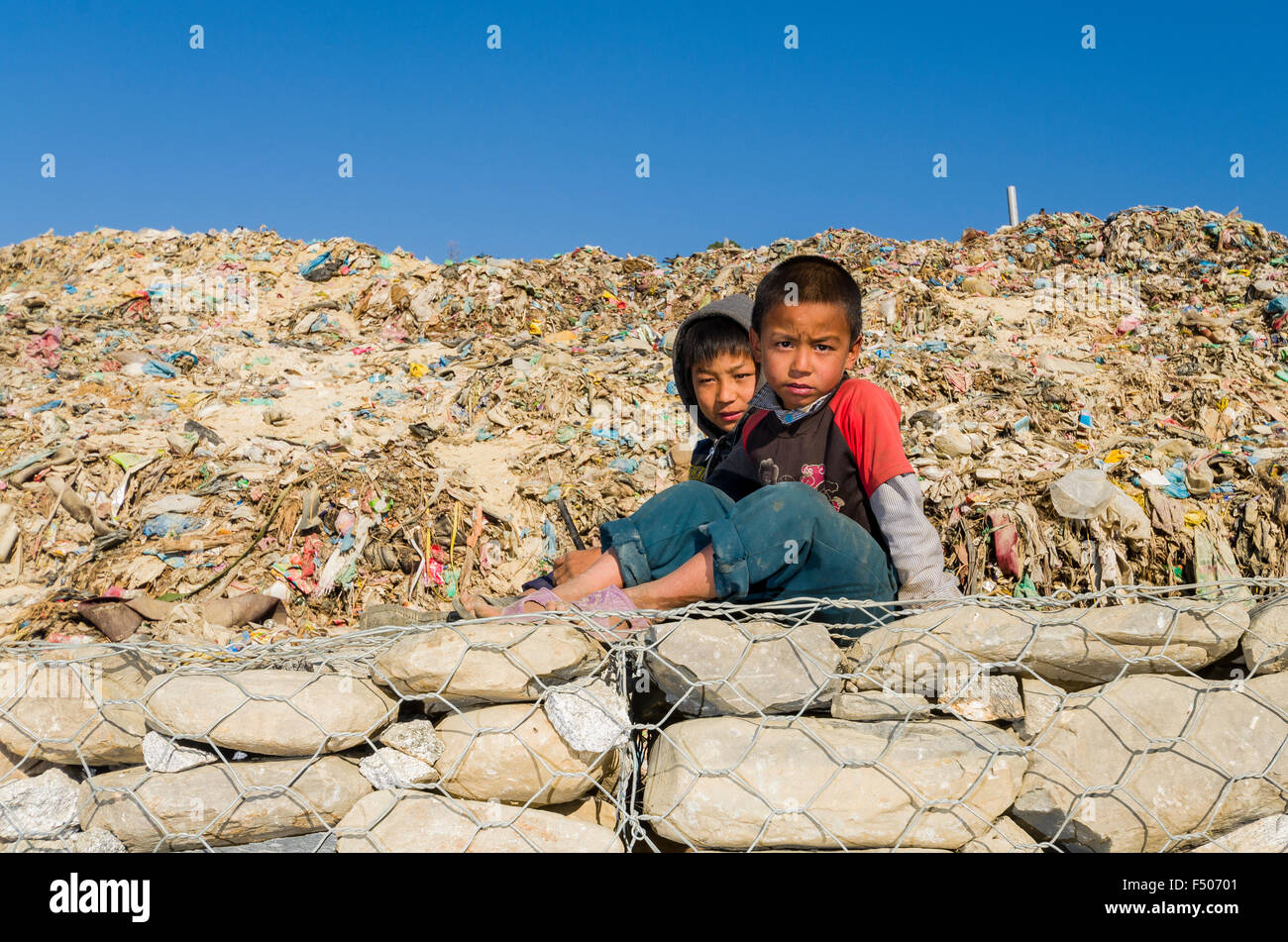 Children live, play and work on the garbage dump at Aletar garbage dump Stock Photo