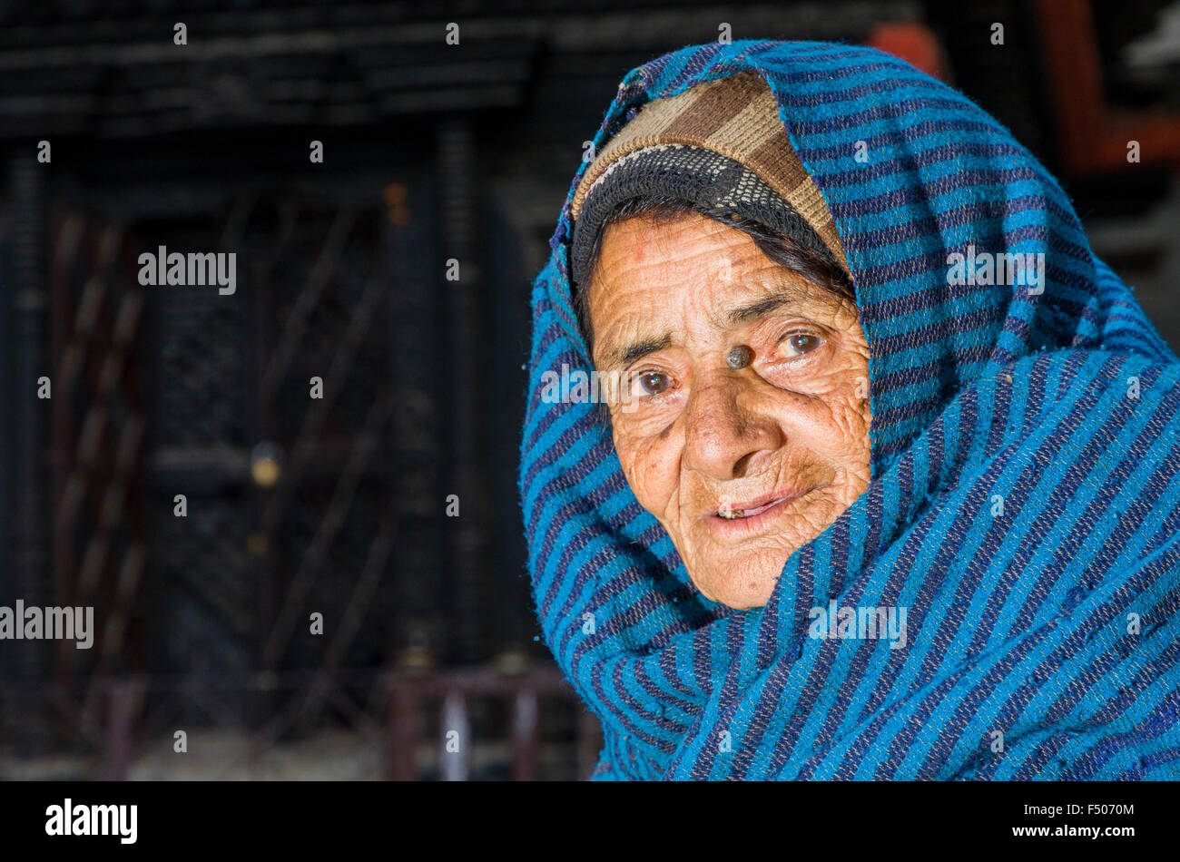 Portrait of an old newari woman, wearing a blue blanket Stock Photo