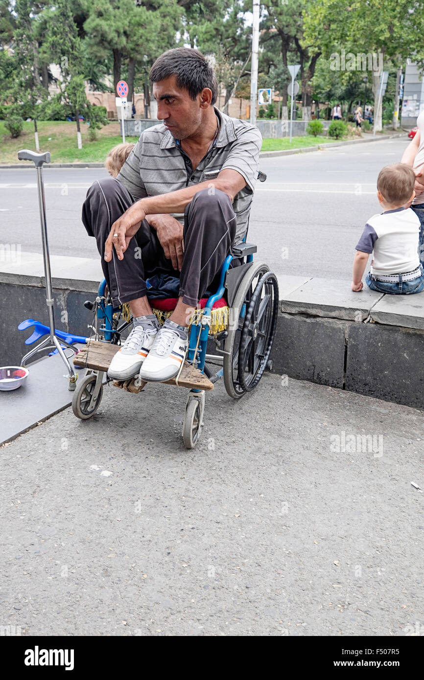 Beggar in wheelchair hi-res stock photography and images - Alamy