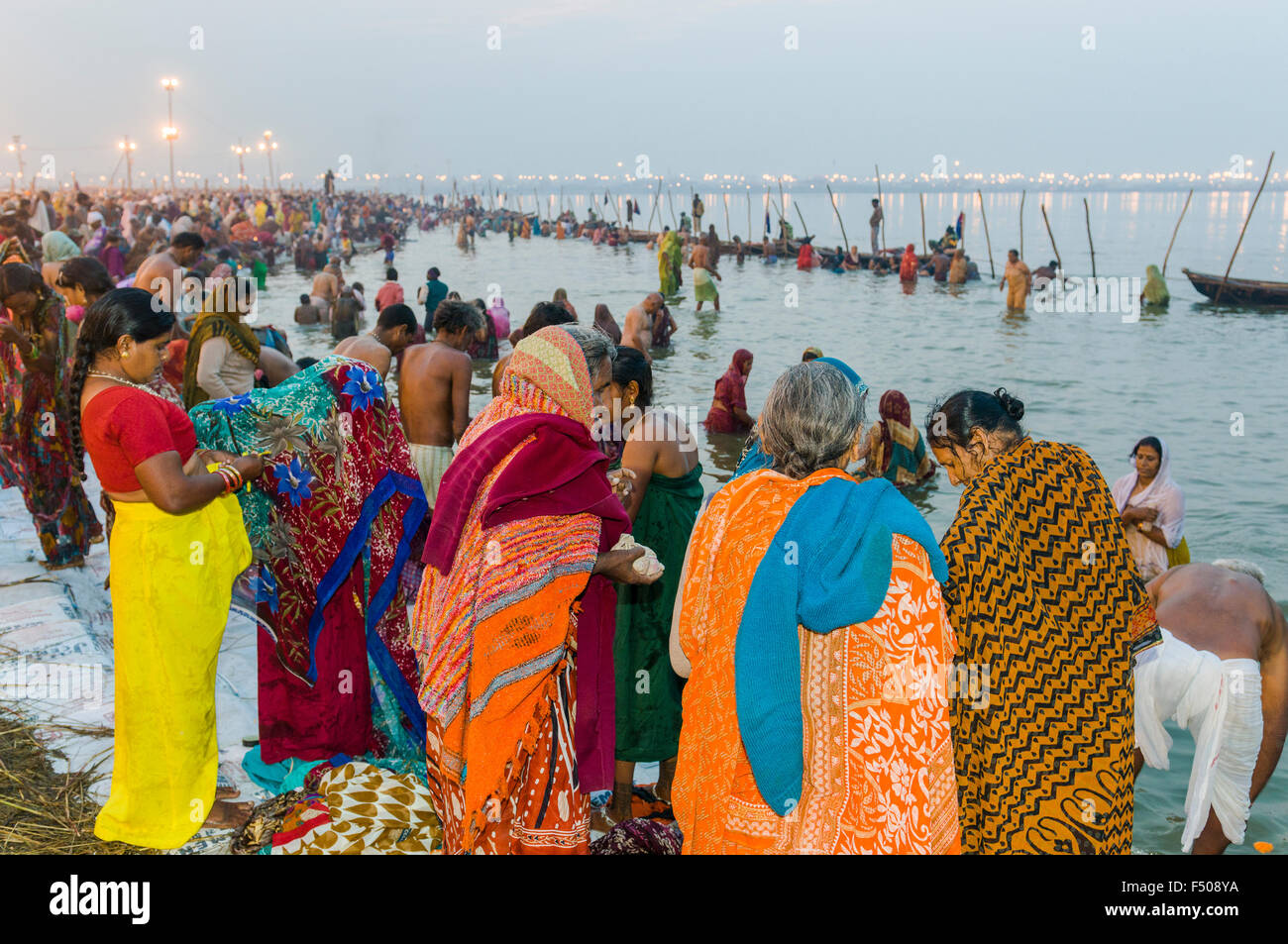 Millions of people gathering early morning at the Sangam, the confluence of the rivers Ganges, Yamuna and Saraswati, for the hol Stock Photo