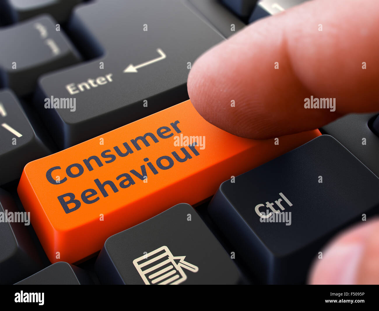 Pressing Orange Button Consumer Behaviour on Black Keyboard. Stock Photo